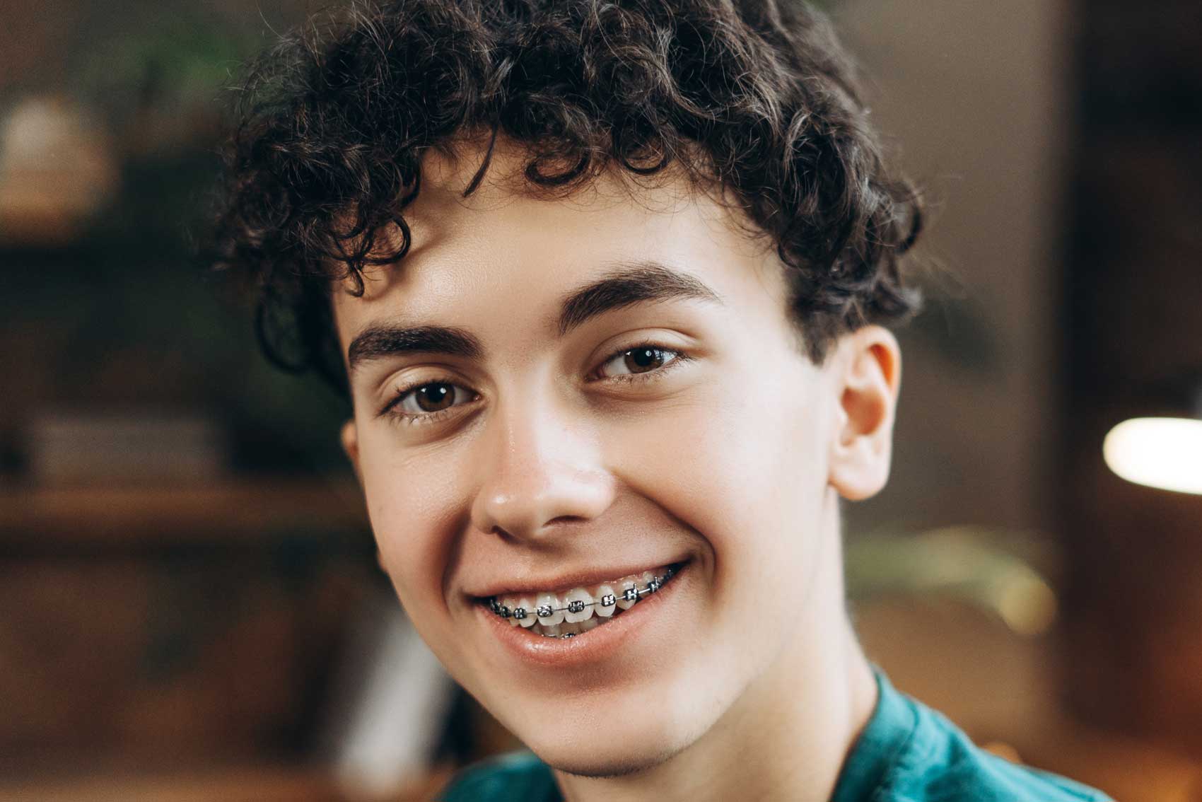Teenager boy smiling with braces